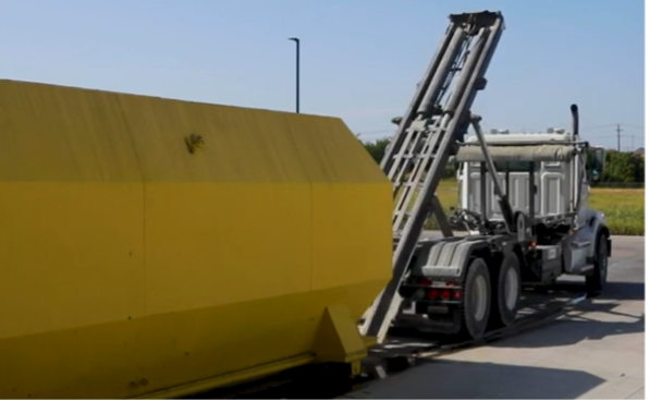 truck loads a recycle bin